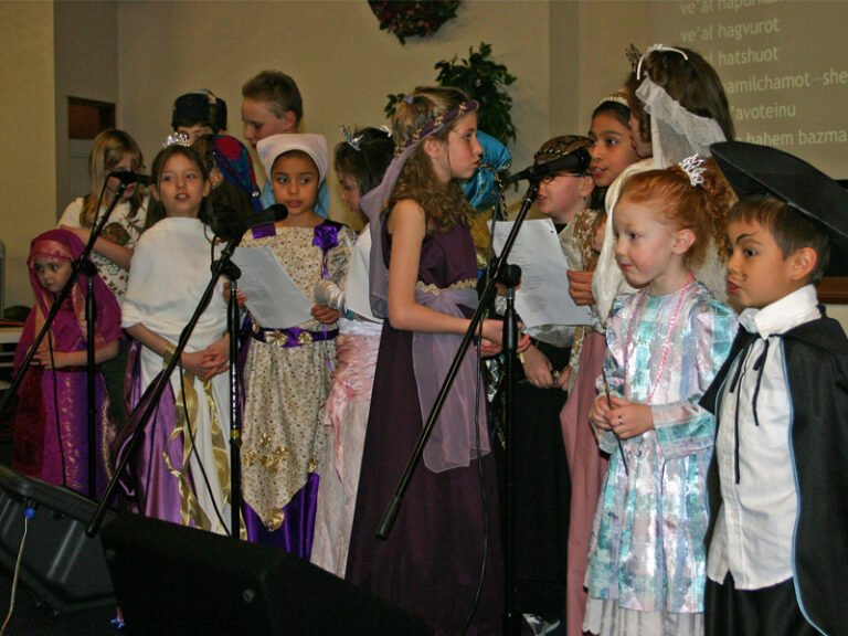 Children singing during a Purim celebration.