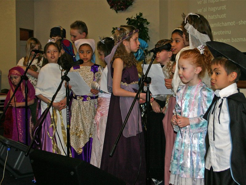 Children singing during a Purim celebration.